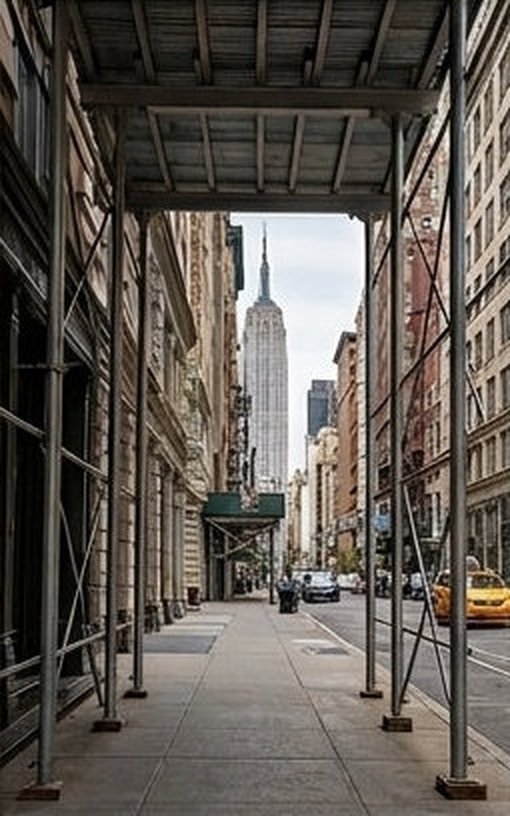 View through construction scaffolding toward the Manhattan skyline