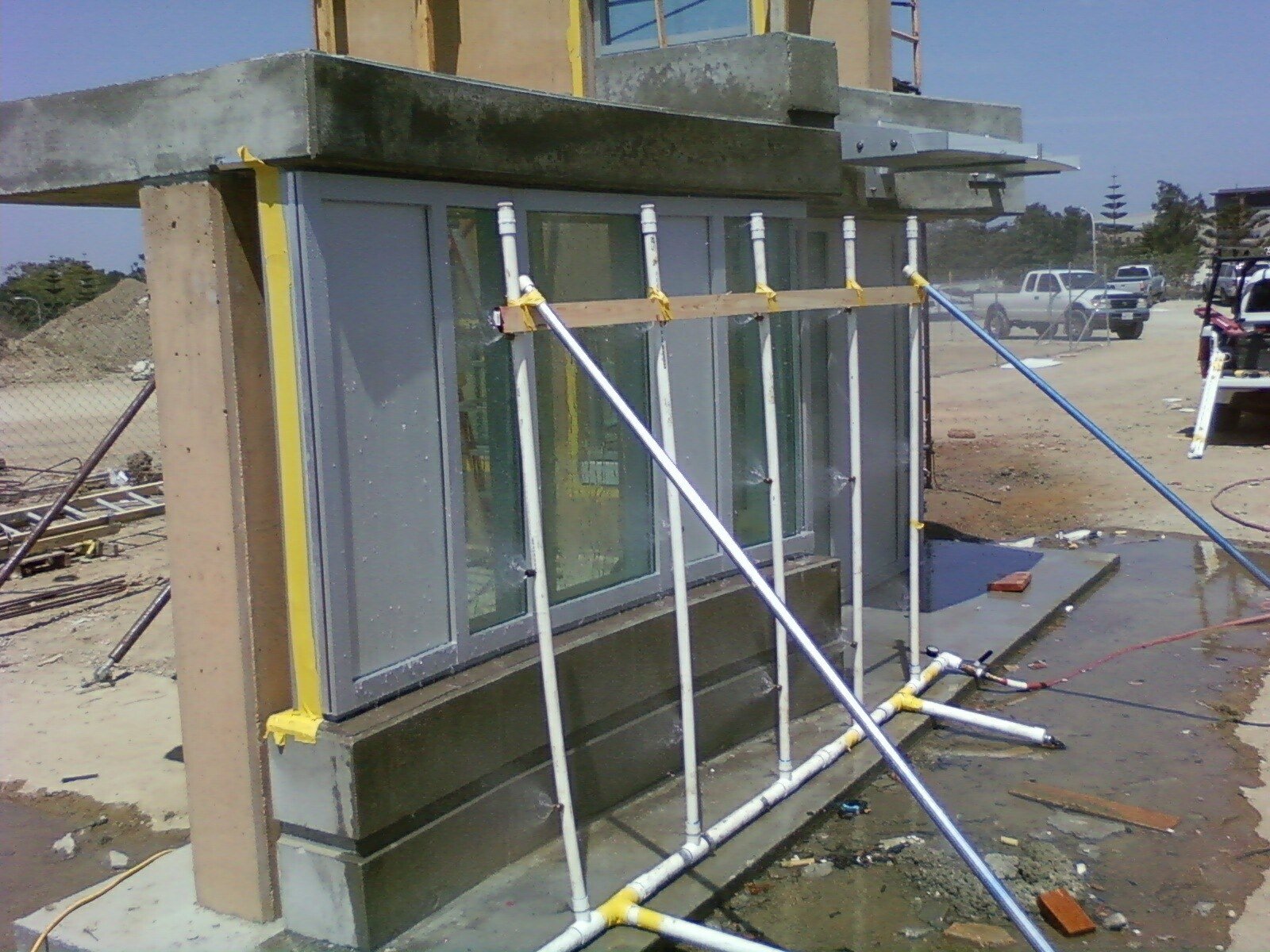 Window mock-up water penetration testing rig on an exterior wall assembly